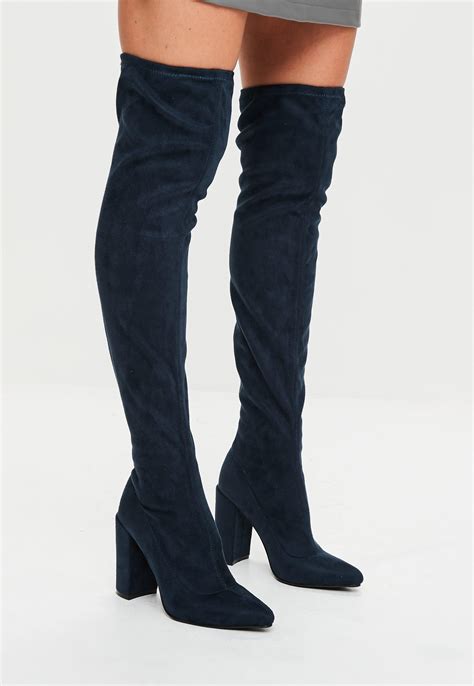 navy blue thigh high boots.